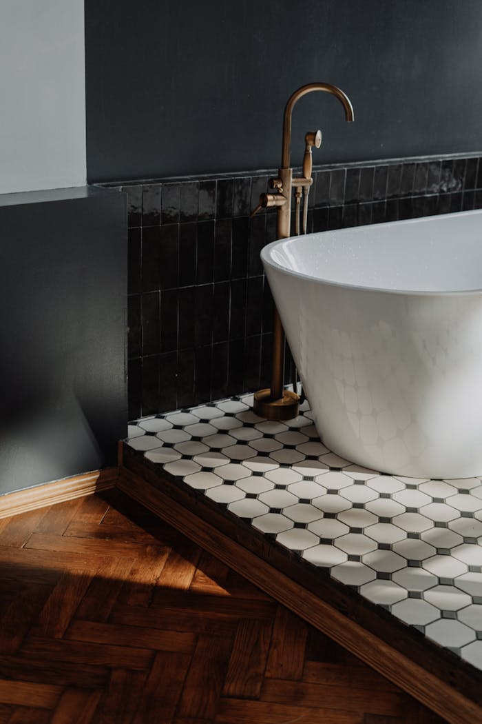 White Ceramic Bathtub With Brass Faucet